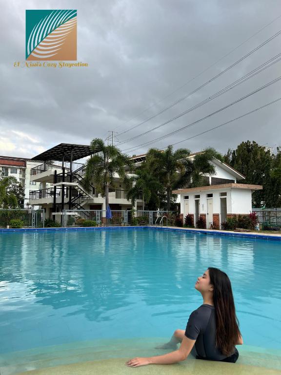 "El Nissi's Cozy Staycation" Beside Enchanted Kingdom photo