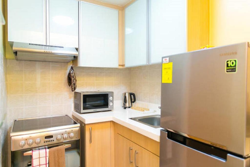 アヴァン アパートメンツ アット ザ フォート バイ ジャズ BGC フォーブス タウン ゴルフ & シティ ビューズ (Avant Apartments At The Fort by Jazz – BGC, Forbes Town, Golf & City Views) キッチン