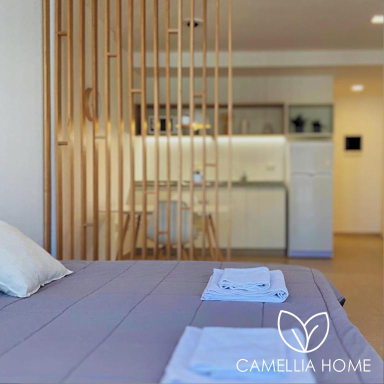 C A M E L L I A - H O M E - 1