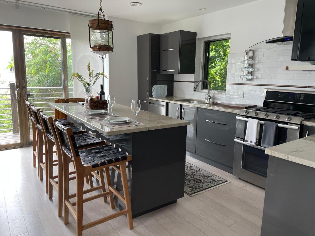 One bedroom with modern kitchen, balcony with water view
