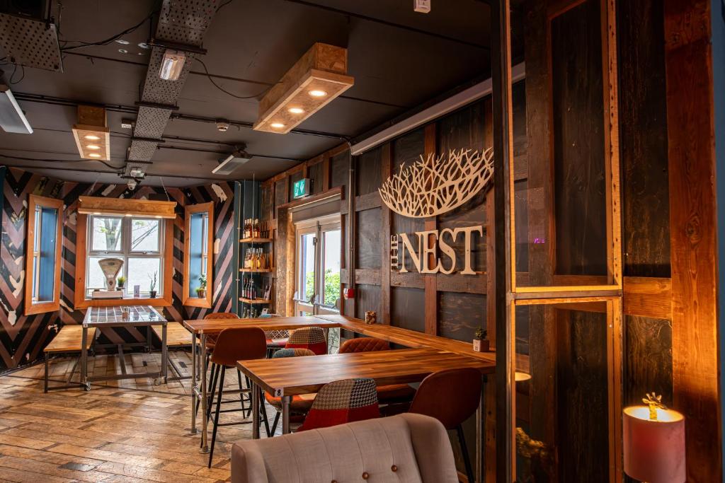 Shared lounge/TV area, The Nest Boutique Hostel in Galway