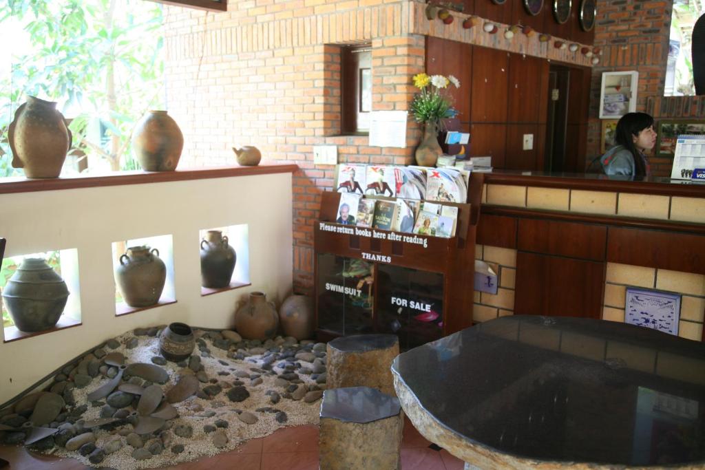 a living room filled with lots of pots and pans, Mui Ne Resort managed by The Sinh Tourist in Phan Thiet