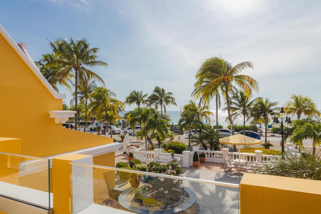 amsterdam manor beach resort terrace viewing the beach and palms