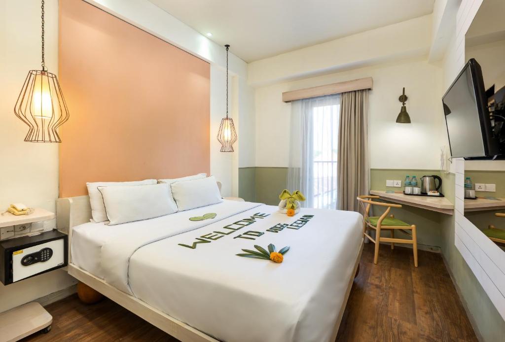 Kamar penginapan di Boss Legian Hotel.
