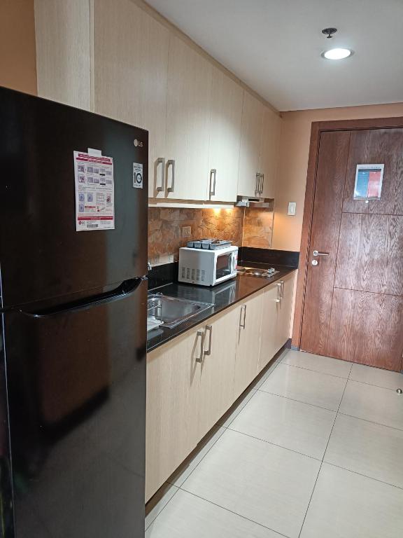 Kitchen, ComfyStay at Shell Residences in Manila