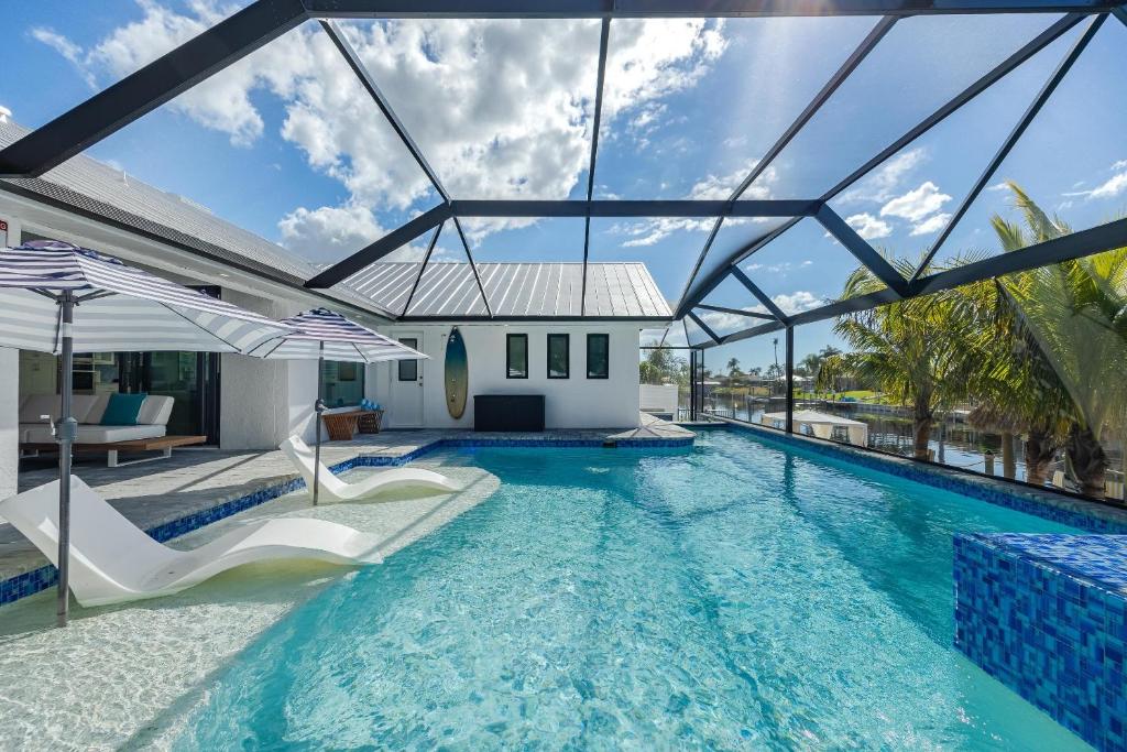 Kayaks, Boat Dock, Heated Pool & Spa, Outside Kitchen, Tiki Hut - Villa Pedro - Roelens Vacations, Cape Coral
