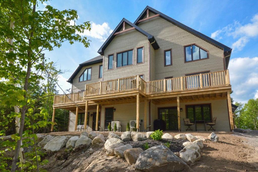 MontTremblant Cottage House with private lake, beach, farm & ranch in SaintFaustin, Canada