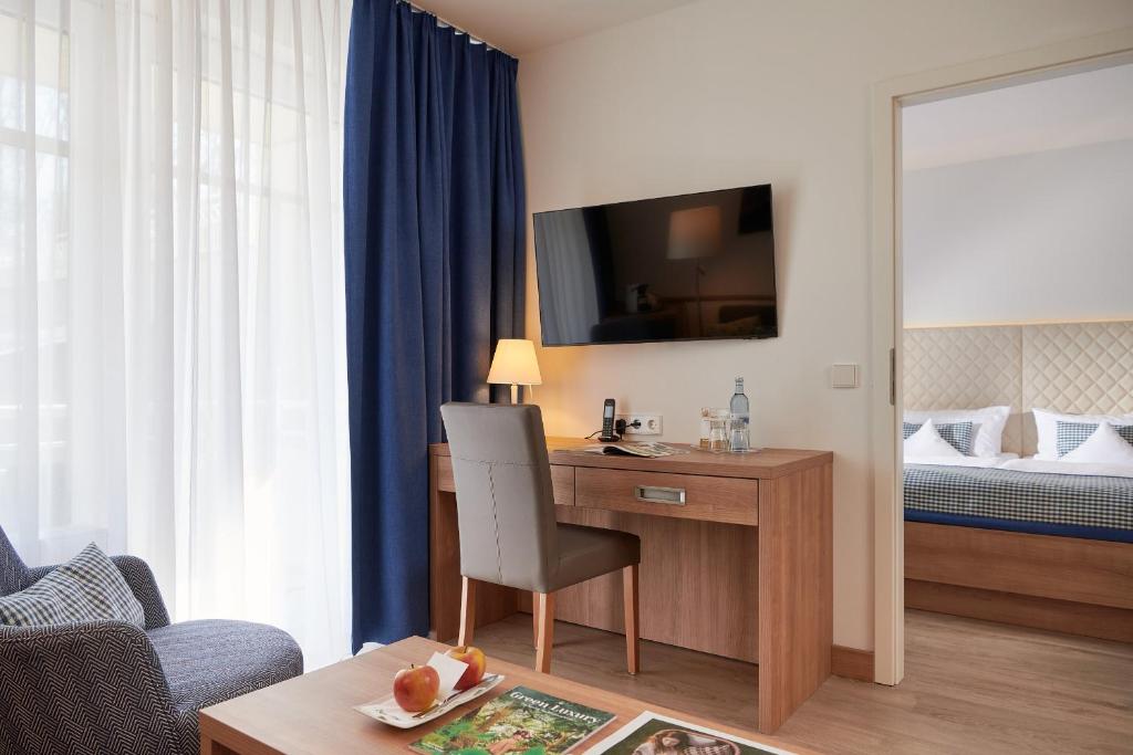 Suite with Balcony and Side View of the Sea