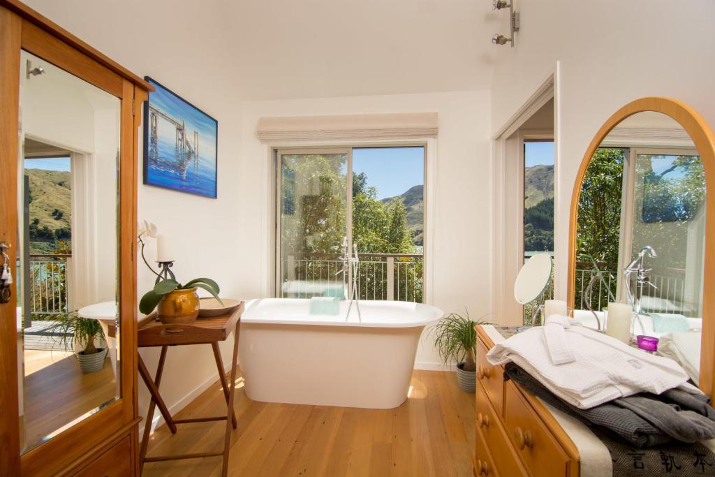 a living room filled with furniture and a window, Cable Bay Nest in Nelson
