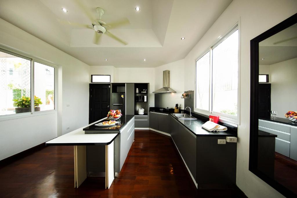 Kitchen, Paradise Pool Villa Pattaya in Tropicana Village in Pattaya