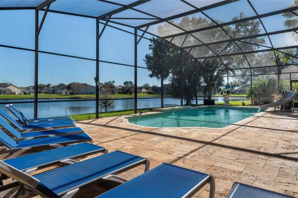 Mickeys Waterside - Gorgeous Waterside Southeast Facing 9BR Pool & Hot Tub BBQ Cinema RM 2 miles to Disney, Orlando