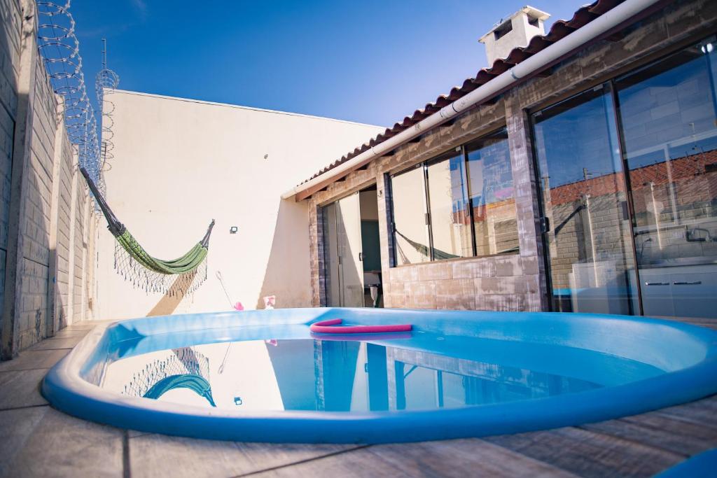 Casa Areal,1 Suíte, 2 Quartos Climatizados, piscina e Estacionamento 2 carros, Pelotas