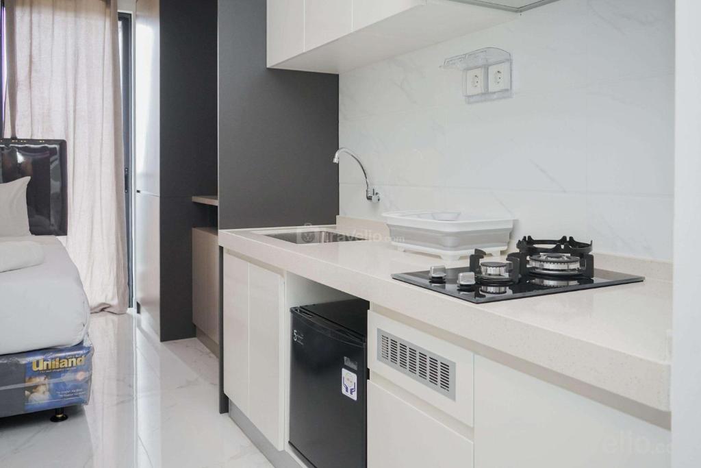 Fully Furnished with Tidy Design Studio at Sky House BSD Apartment By Travelio, Tangerang