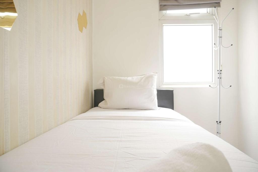 Modern and Classic 2BR at Green Pramuka City Apartment By Travelio, Jakarta