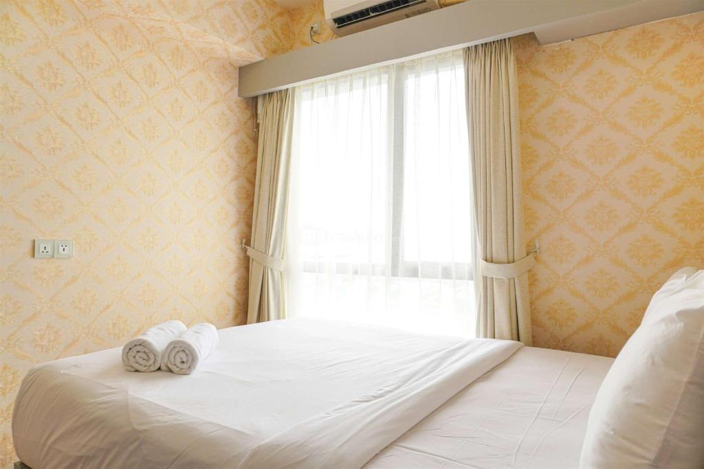 Spacious and Nice 1BR with Extra Room at Sky House BSD Apartment By Travelio, Tangerang