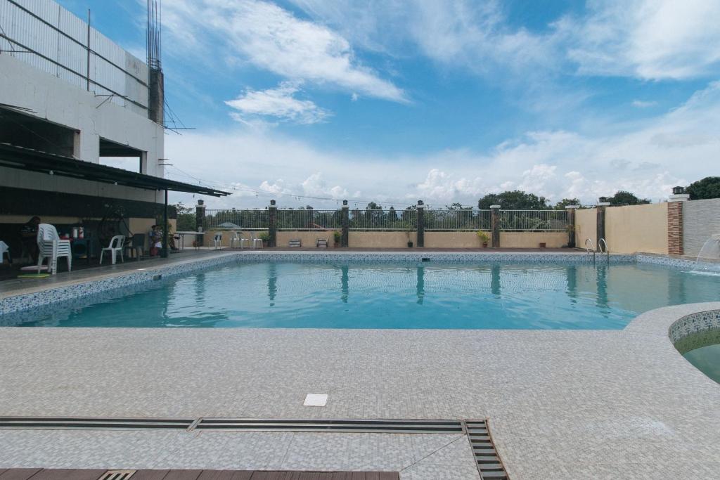 Swimming pool, RedDoorz @ ARRS HOTEL & RESORT in Tagum