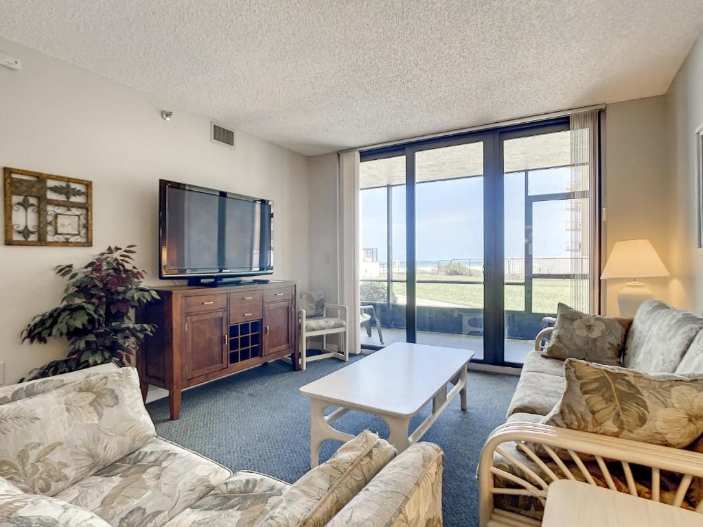 Beachfront with a pool at Ocean Trillium Condo ~ 101, New Smyrna Beach