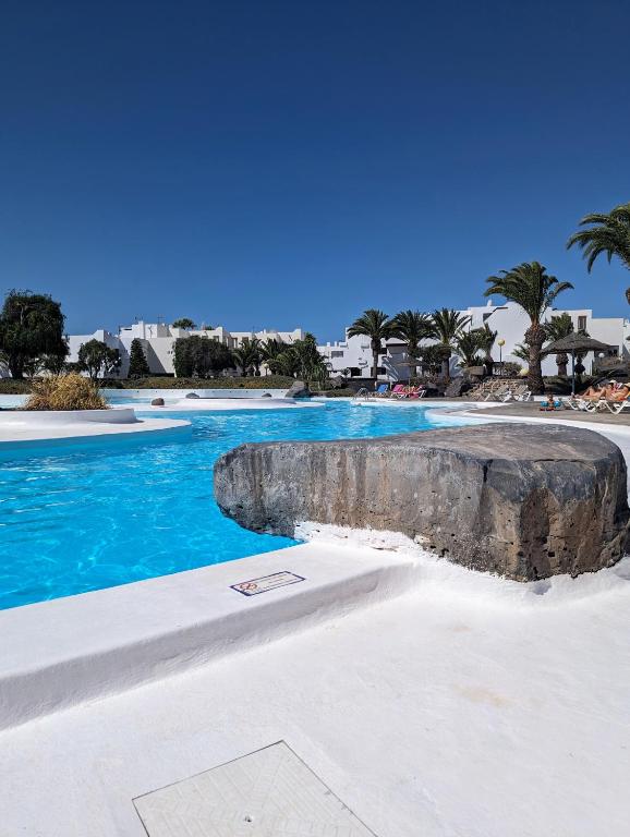 Charming Flat in Los Molinos with Terrace & Pools, Near Playa Bastian, Costa Teguise