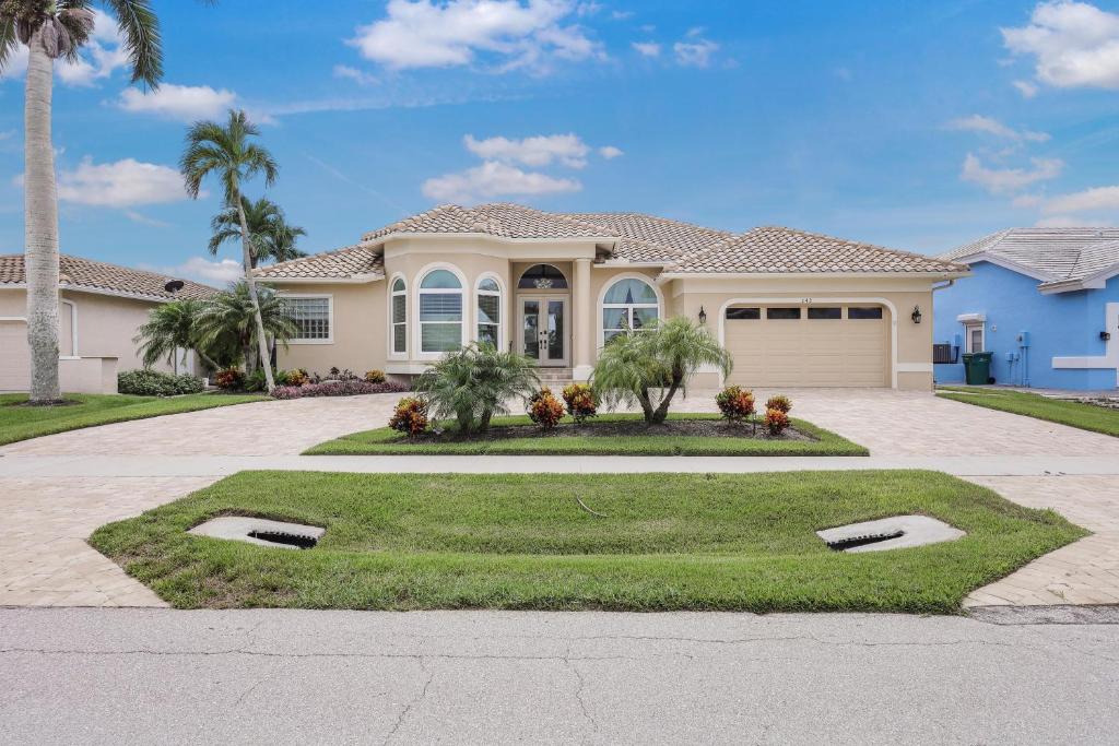 Alluring waterfront home with W exposure, pool/dock, Marco Island