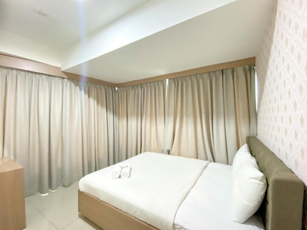 Fancy and Nice 3BR at Grand Kamala Lagoon Apartment By Travelio, Bekasi