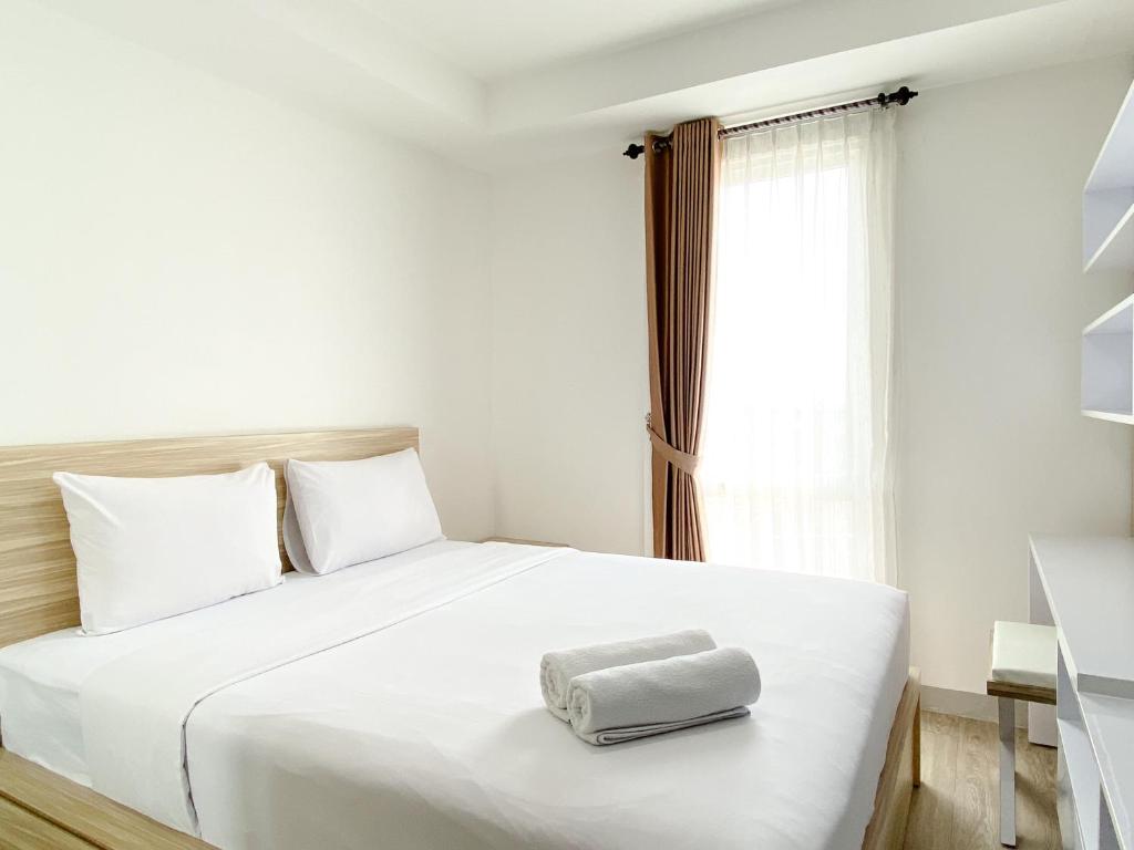 Homey and Compact Studio at Azalea Suites Apartment By Travelio, Cikarang