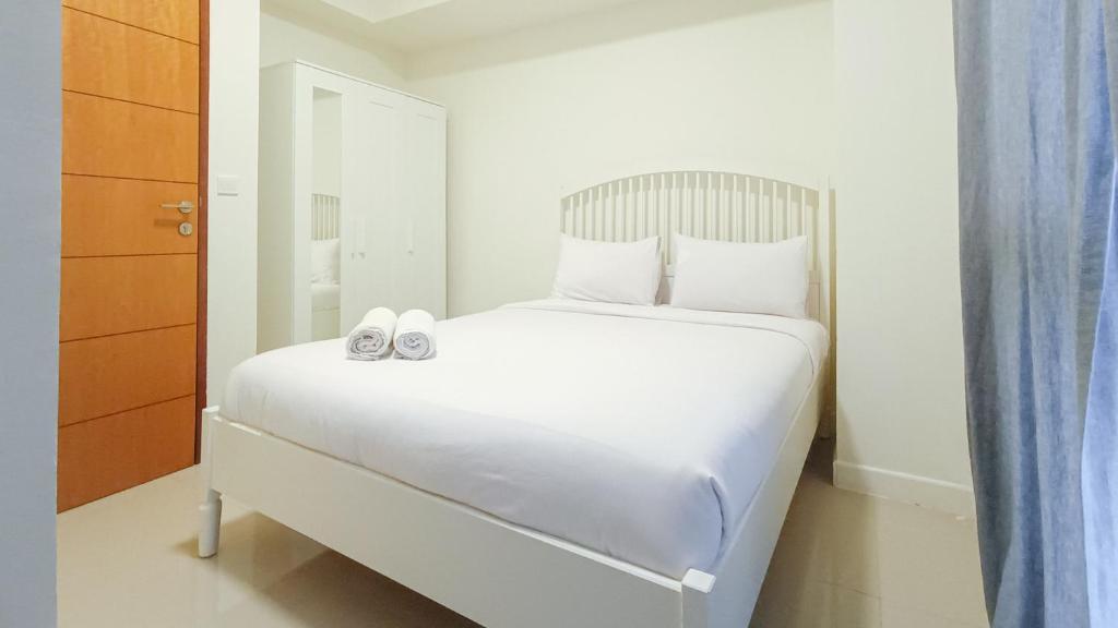 Comfortable and Tidy 2BR at Vida View Apartment By Travelio, Pampang