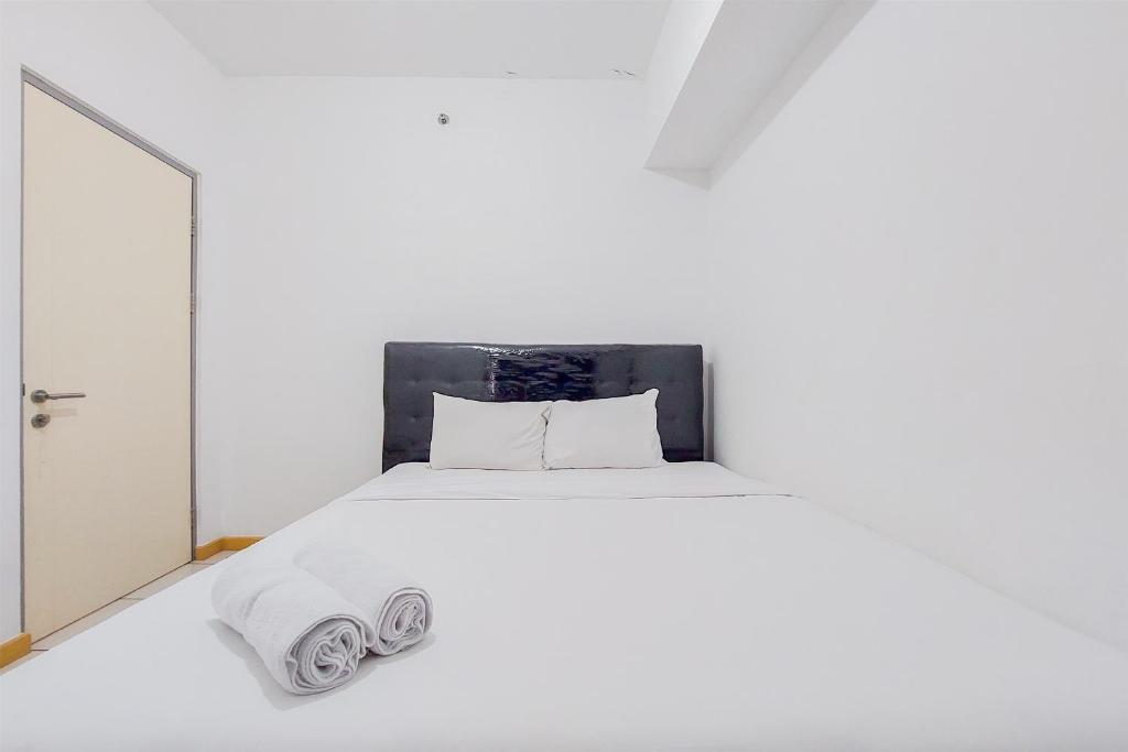 Simple and Comfort Design 2BR Apartment at M Town Residence By Travelio, Tangerang
