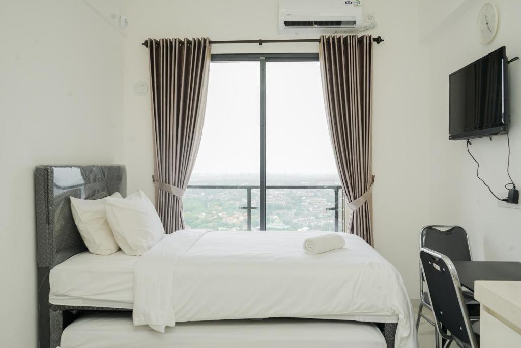 Cozy and Nice Studio at Sky House BSD Apartment By Travelio, Tangerang