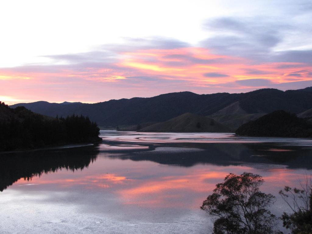 a view of a lake from a boat in the water, Cable Bay Nest in Nelson