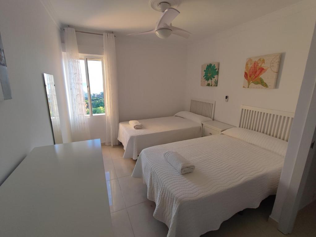 Hercules Paradise 531 - Mediterranean Sea View Terrace - Resort Pools & Gardens - 10 Min Beach - Central Benalmadena - Direct Train to Airport & Malaga - Fast Private WiFi - Remote Work and FireTV ready - 4