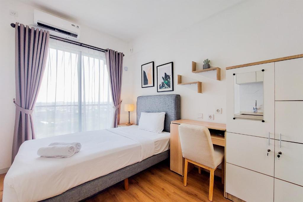 Warm and Simply Studio Apartment at Sky House BSD By Travelio, Tangerang