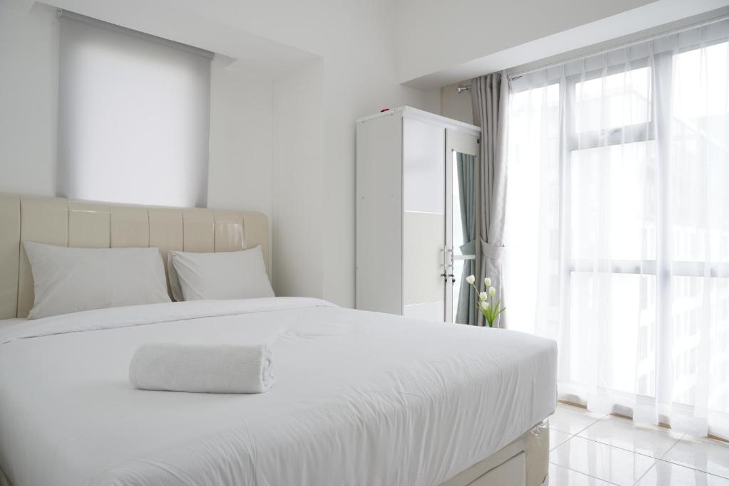 Elegant 1BR Apartment at M-Town Residence near Summarecon Mall By Travelio, Tangerang