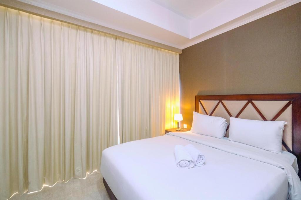 Comfy and Cozy 2BR at Menteng Park Apartment By Travelio, Jakarta