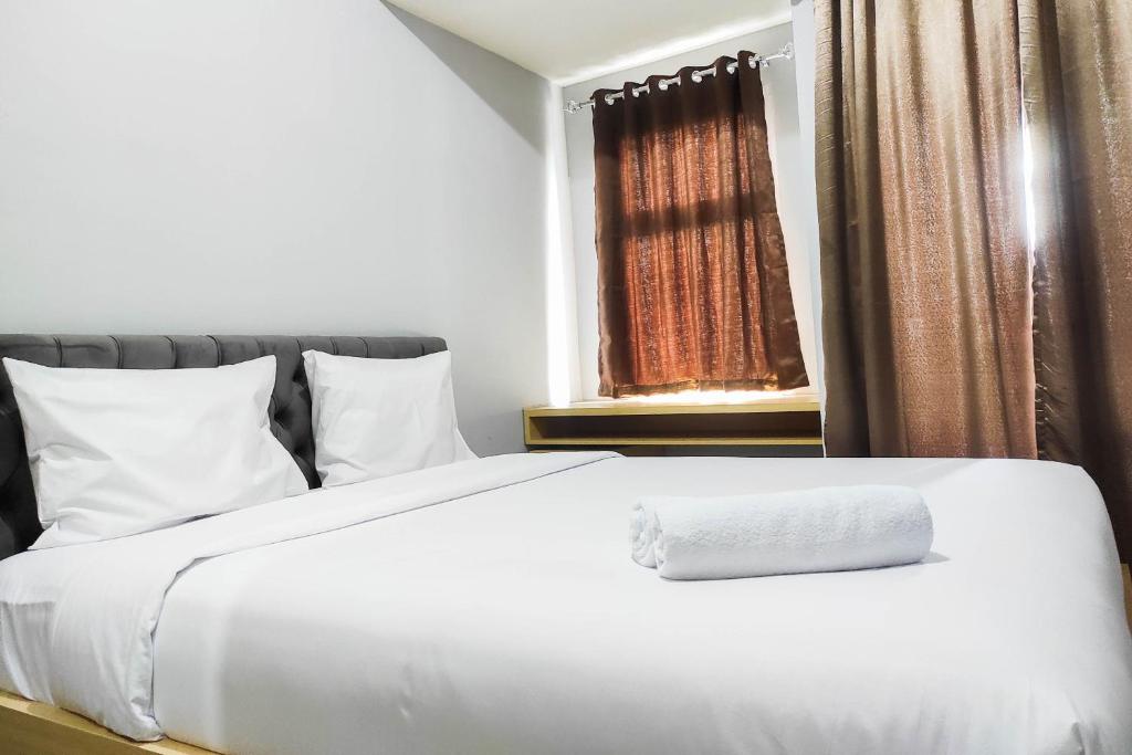 Comfy and Minimalist Studio at Vida View Apartment By Travelio, Pampang