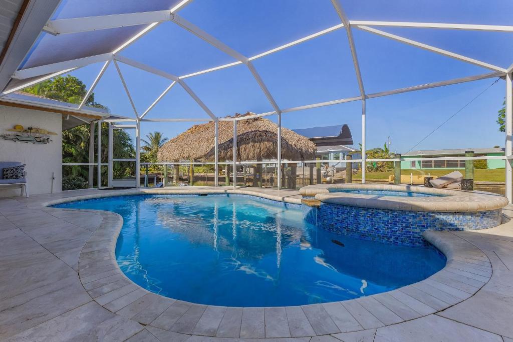 Gulf Access Dock with Tiki Heated Pool Casa Chillotta Roelens, Cape Coral