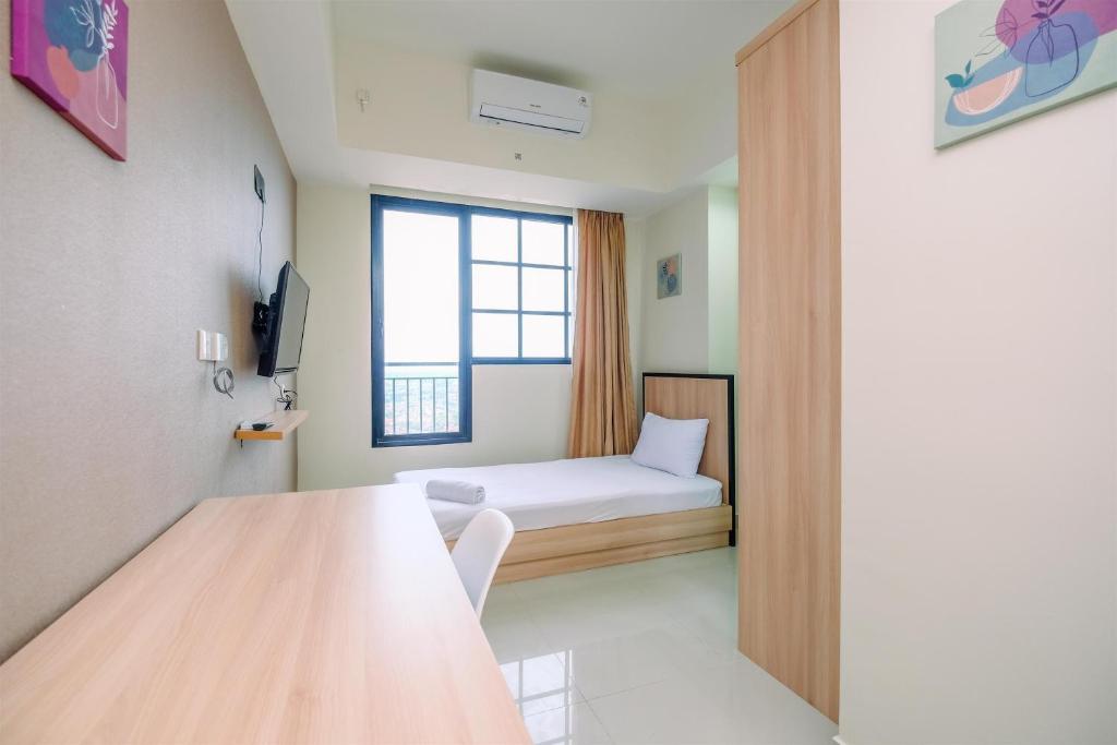 Nice 2BR at 26th Floor Evenciio Margonda Apartment By Travelio, Depok