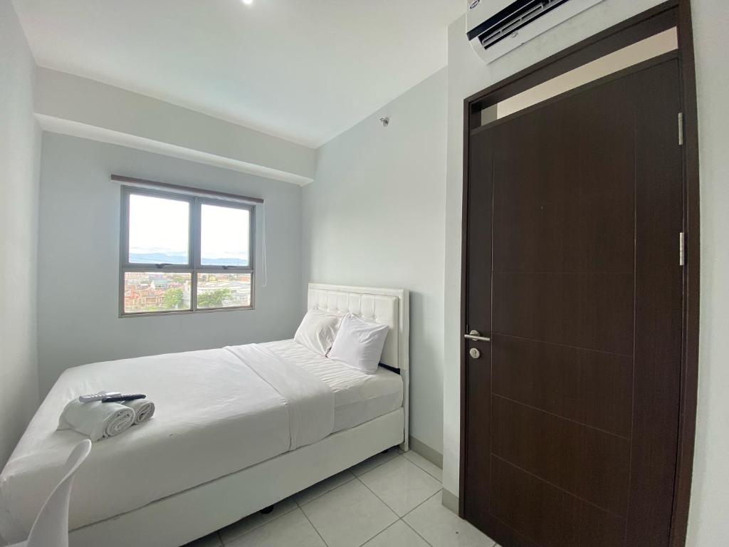 Bright and Relaxing 2BR Apartment at Mekarwangi Square Cibaduyut By Travelio, Bandung