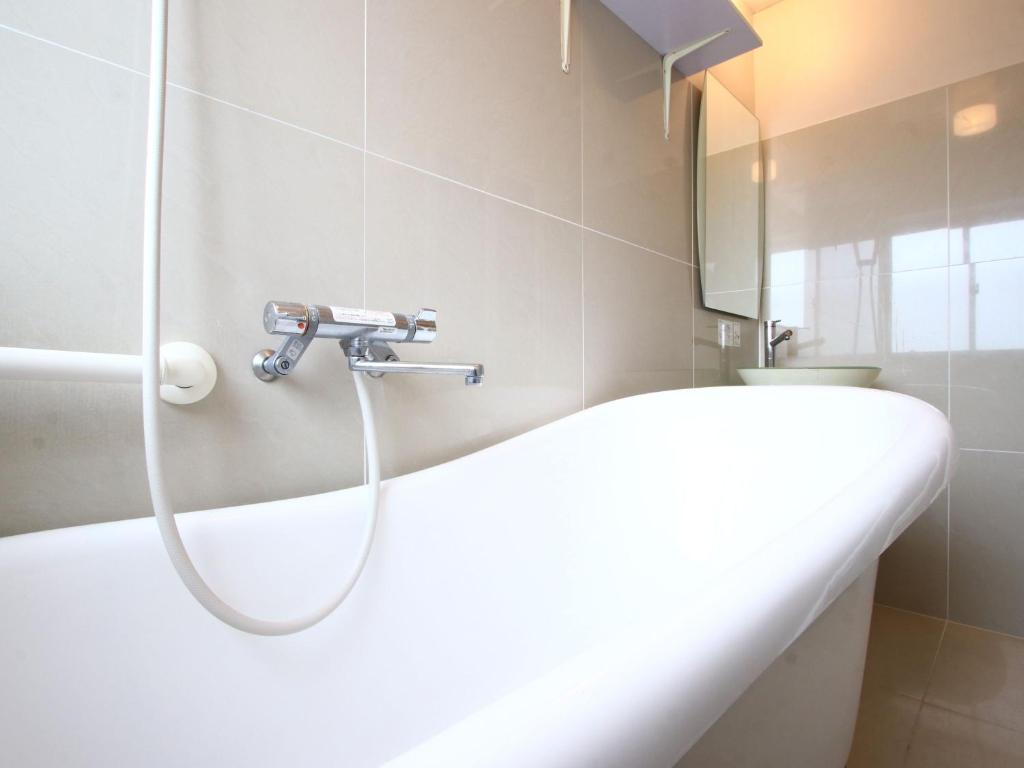 Bathroom, Hotel Bali Moon in Izu