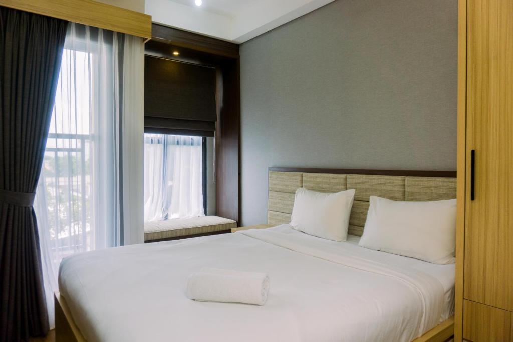 Minimalist and Warm Studio at Transpark Bintaro Apartment By Travelio, Tangerang