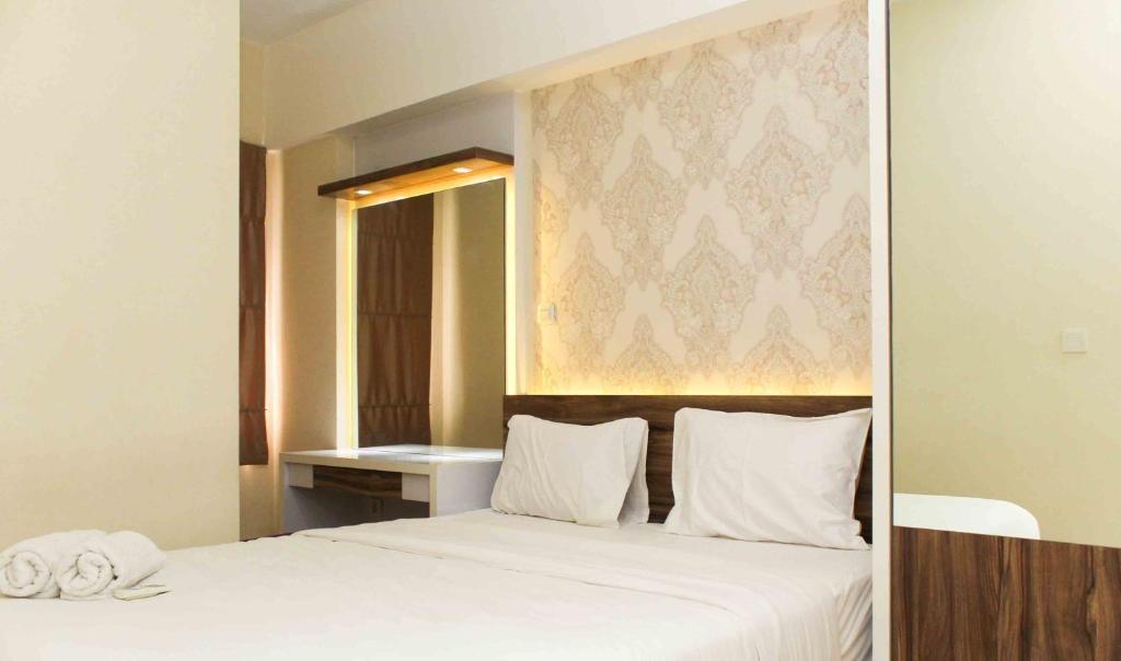 Spacious and Nice 2BR at Springlake Summarecon Bekasi Apartment By Travelio, Bekasi