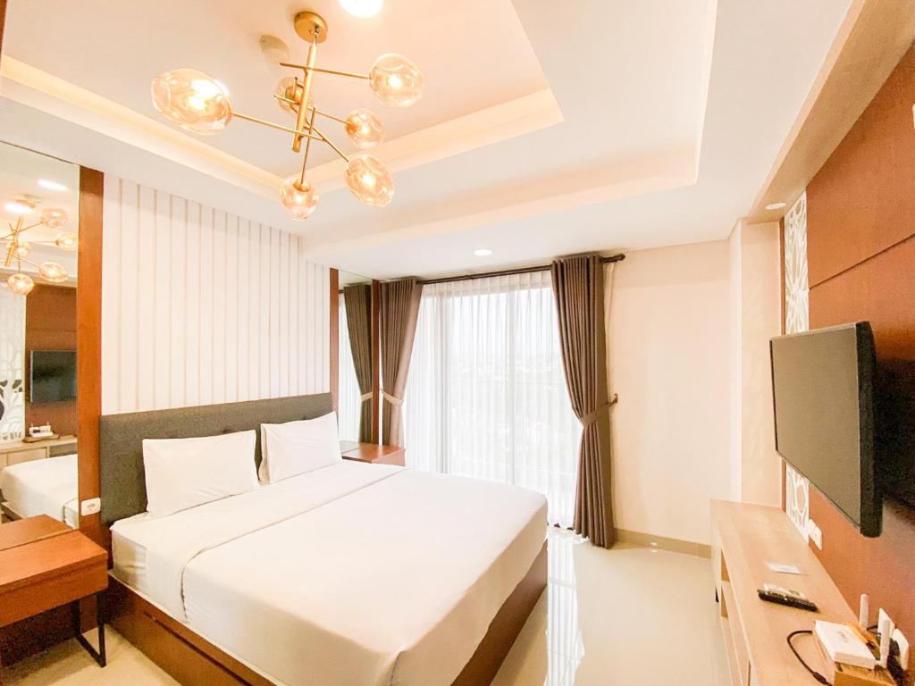 Good and Restful Studio at Patraland Amarta Apartment By Travelio, Kejayan