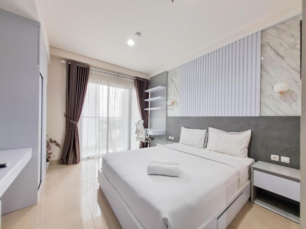 Good and Cozy Studio at Patraland Amarta Apartment By Travelio, Kejayan