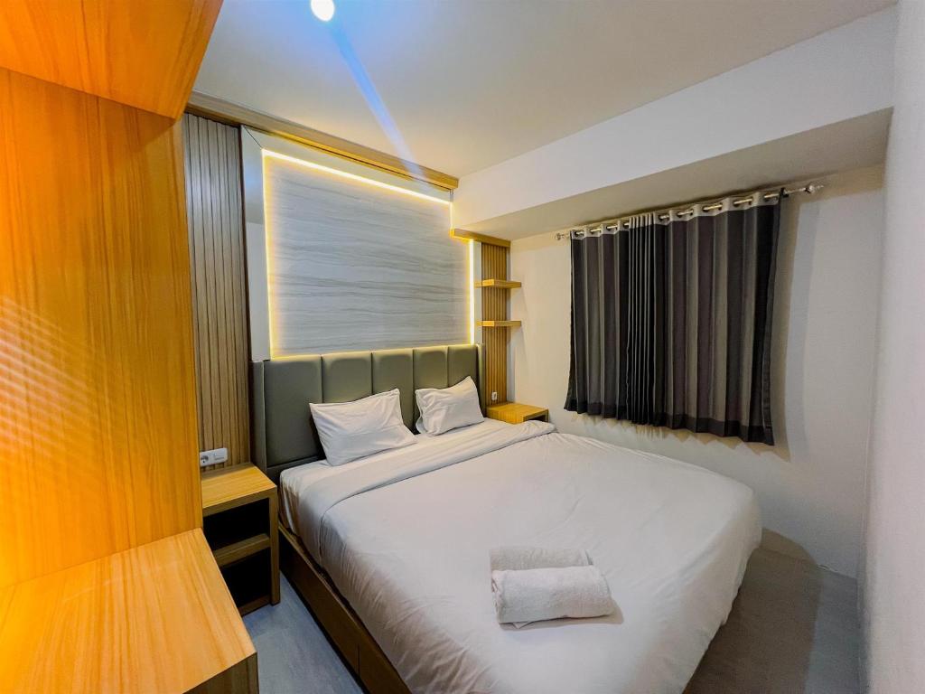 Compact and Relaxing 2BR at Suncity Residence Apartment By Travelio, Sidoarjo