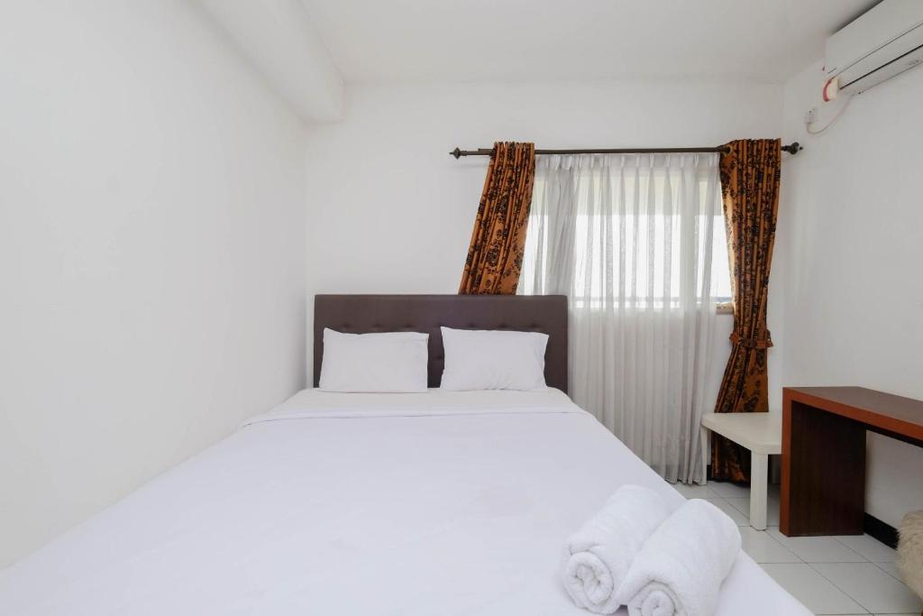 Nice and Elegant 1BR at The Wave Kuningan Apartment By Travelio, Jakarta