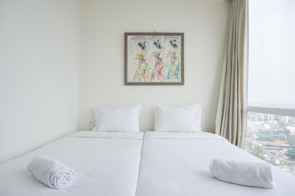 Nice and Elegant 2BR at 26th Floor Menteng Park Apartment By Travelio, Jakarta
