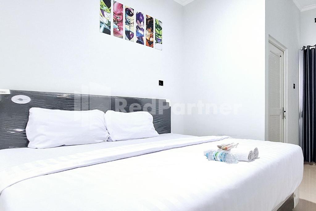 Aster Triplets Guest House JCM Mitra RedDoorz