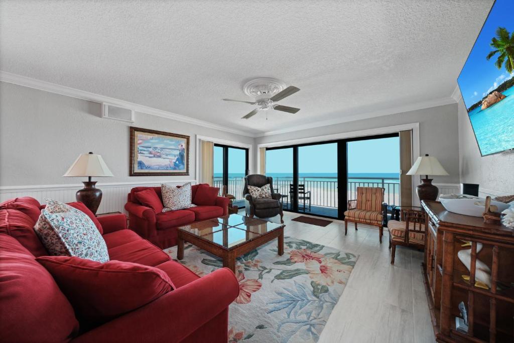 Oceanfront corner views with wrap around balcony and complex pool, New Smyrna Beach