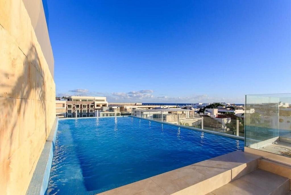 A pasos de la playa | Apartamento elegante en la Quinta Avenida con piscina en la azotea - 5