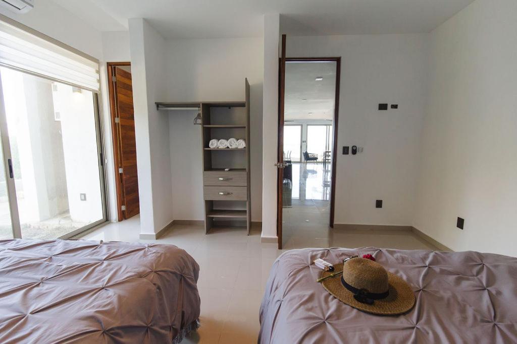 Angelina 28 Beachfront and Family Apartments - Modern and Relaxing Long Stays - 20 min from Cancun Airport - 4
