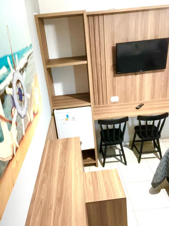 Suíte 31 Privativa com ar condicionado, Frigobar, Vista lateral para o mar, 5 mts da praia, Cabo Frio